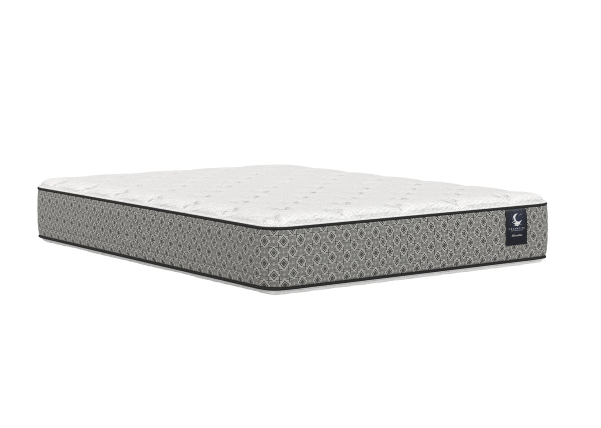 Angled view of the SilverStar two-sided mattress with white quilted surfaces and dark grey side panels.